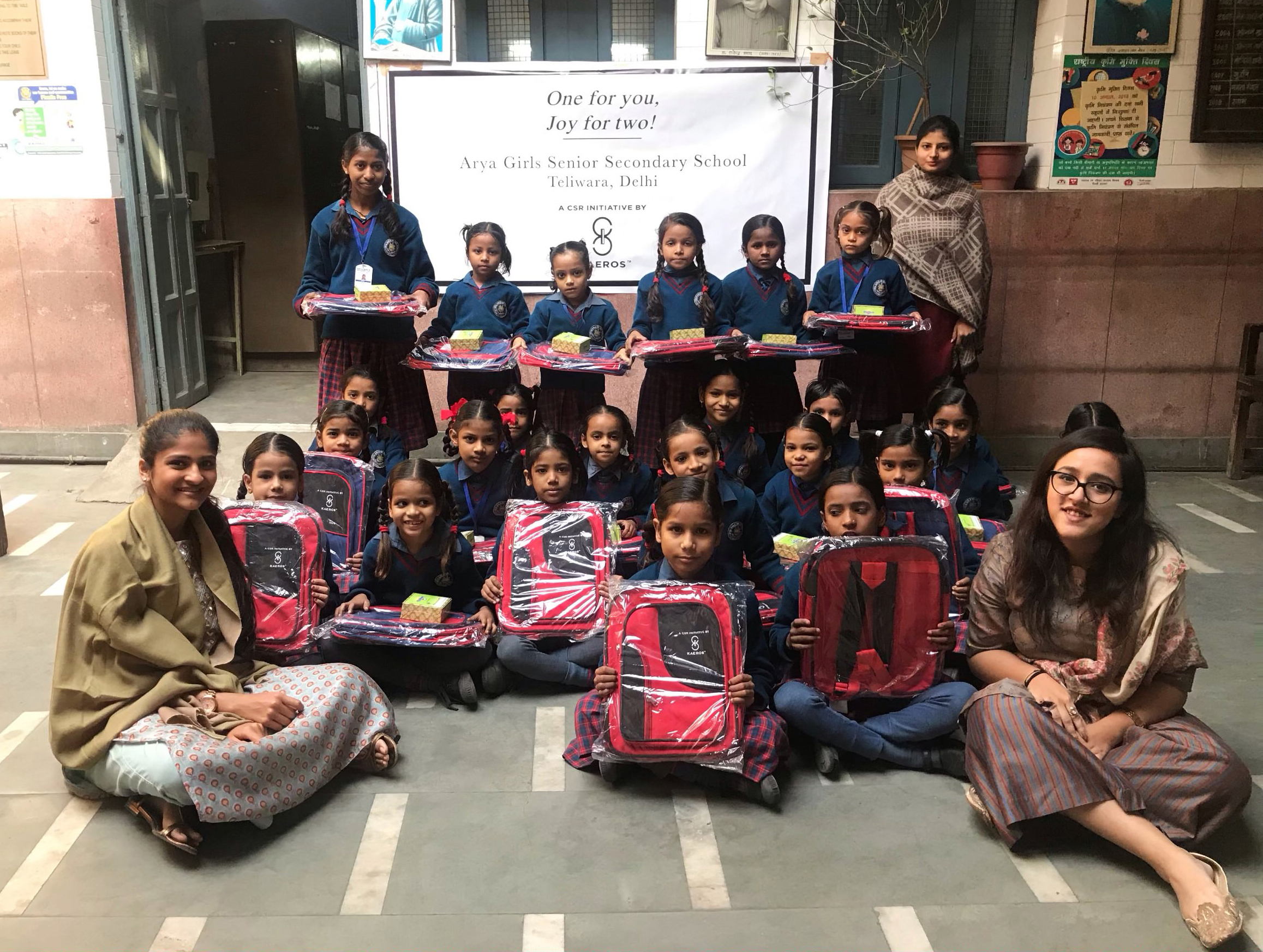 KAEROS distribute school Bags to Girls at Arya Girls Sr. Sec. School in Teliwara, Delhi